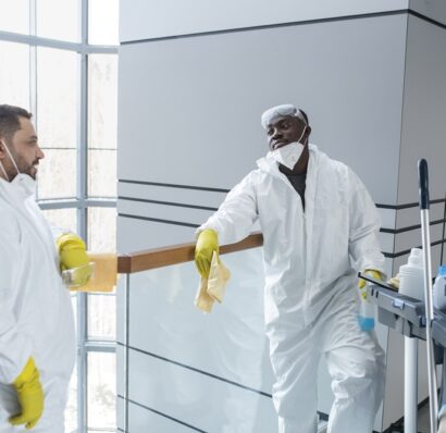 medium-shot-people-wearing-hazmat-suits